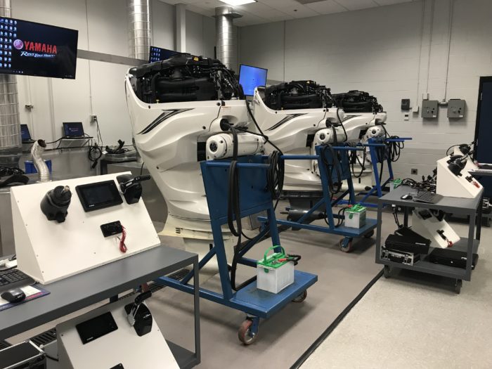 Yamaha boat engines in a testing facility.