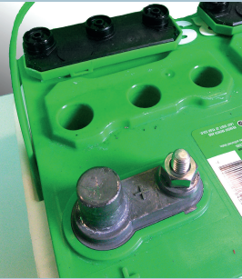 Close-up of a green battery terminal.