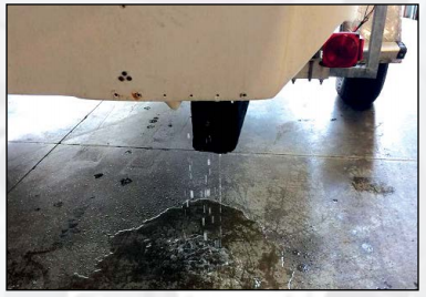 Water dripping from trailer underside.