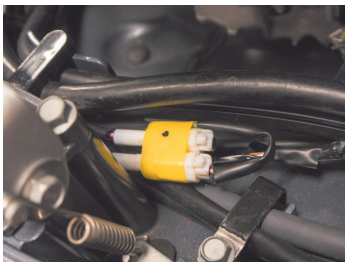 Wired connectors with yellow insulation in engine.