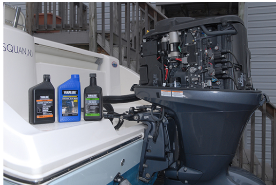 Outboard motor with marine oil containers.